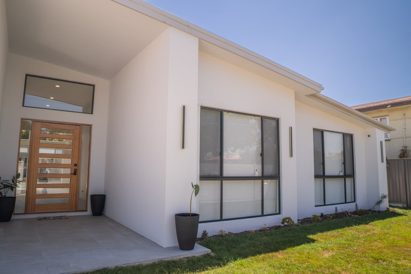 Front entry with a timber pivot door
