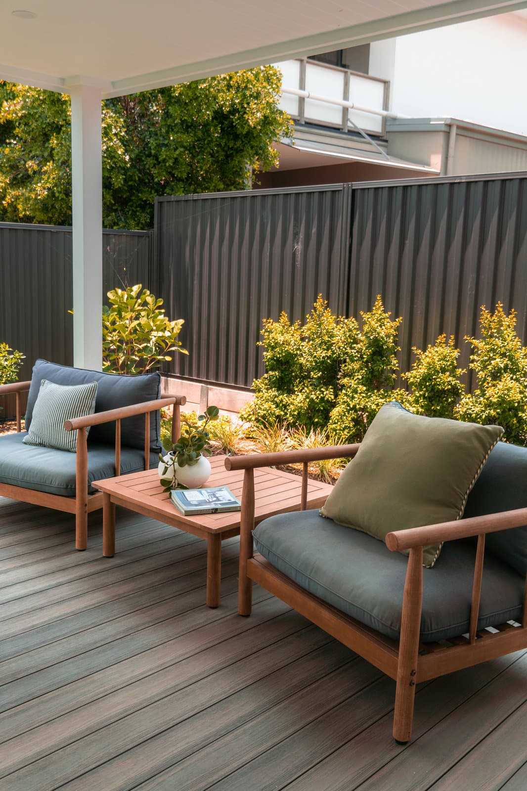 Outdoor lounge setting in a landscaped courtyard