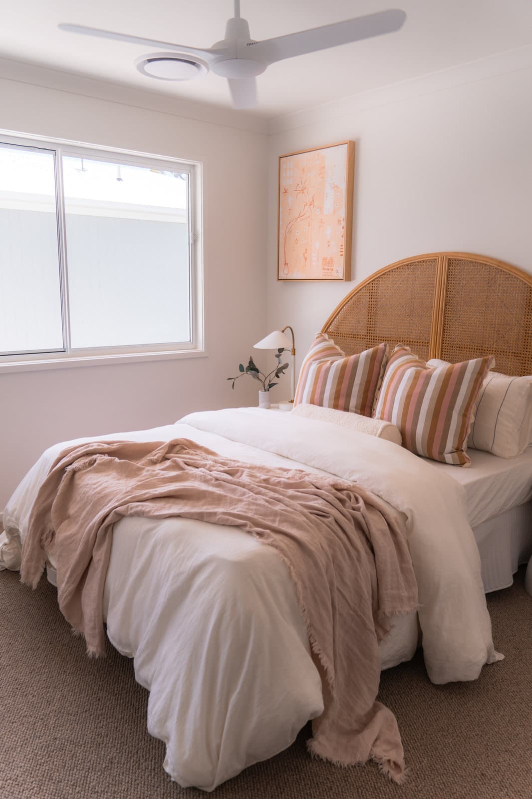 Main bedroom with a rattan bedhead